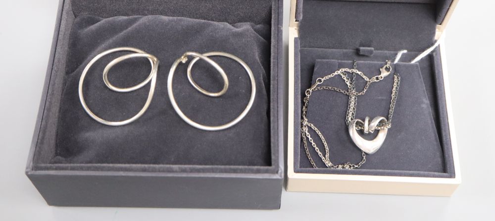 A Georg Jensen pair of sterling silver swing earrings, No. 554B, Alliance Collection and a Double Heart sterling silver pendant,
